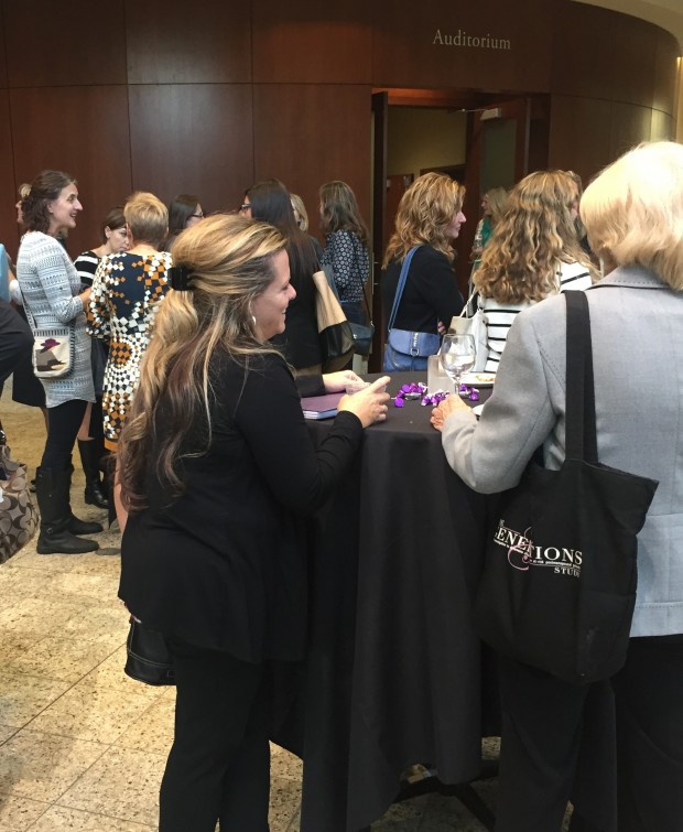 St. Thomas alumnae gather outside the Schulze Auditorium for Women Connect's Smart Women Lead event. The group reaches out to female graduates in all professions. (Rachel Weiss/TommieMedia) 