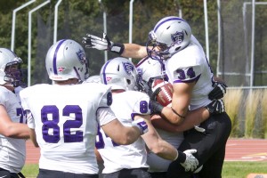 St. Thomas running back Brenton Braddock celebrates with the Tommie offense. Braddock was good for two touchdowns in the first half of Saturday’s game. (Jake Remes/TommieMedia)