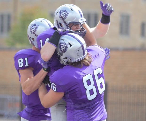 Tommies celebrate a touchdown. St. Thomas finished the first half with a 23-0 lead over Wisconsin-La Crosse. (Andrew Brinkmann/TommieMedia)