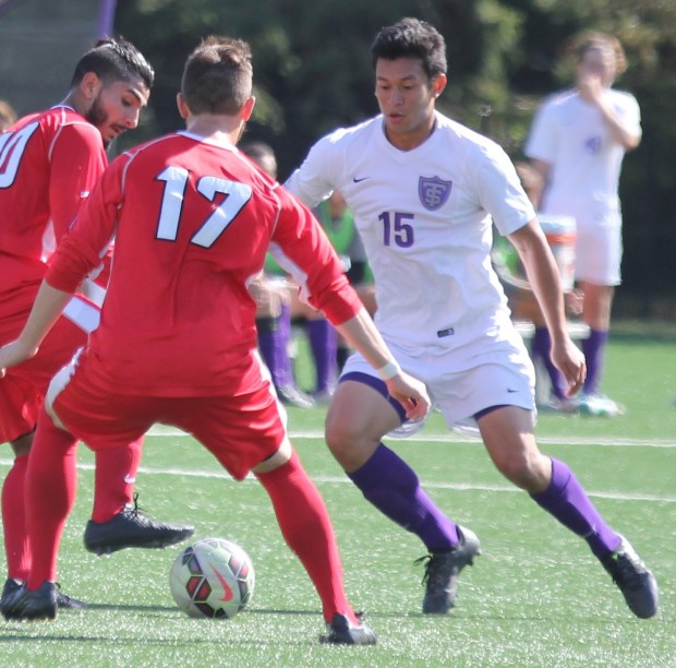 Defender Shane Marshall attempts to maneuver around two Carthage players. St. Thomas fell 1-0 to Carthage Wednesday at South Field. (Eric Bromback/TommieMedia)
