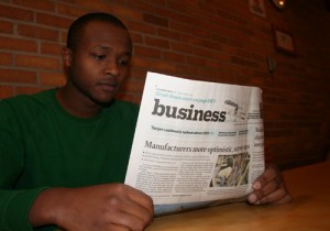 Kamal reads the paper. (Ben Katzner/TommieMedia)