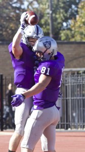 Tight end Charlie Dowdle lifts wide receiver Nick Waldvogel into the air after a touchdown. St. Thomas leads Hamline 50-0 at halftime Saturday. (Andrew Brinkmann/TommieMedia)