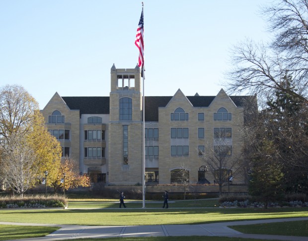 Flags sit idly in front of the O'Shaughnessy Frey Library. (Tom Pitzen/TommieMedia) 