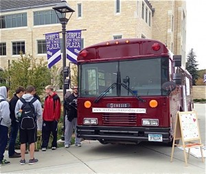 The Love Your Melon bus parks outside the Anderson Student Center for the official Love Your Melon Day on October 22nd, 2013. Juniors Brian Keller and Zachary Quinn will continue their mobile head-shaving idea across the nation in January. (Photo courtesy of Zachary Quinn)