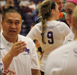 Coach Thanh Pham stares intently at his players from the sidelines of a game earlier this season. The St. Thomas volleyball team played the season's last game Saturday. (Tom Pitzen/TommieMedia)