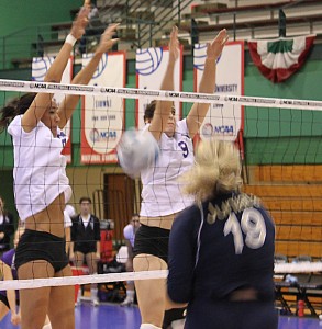 <p>Seniors Emily Foster (left) and Jill Osborne rise up to block Juniata freshman Taylor Harpster. Osborne had three blocks in the match. (Jordan Osterman/TommieMedia)</p> 