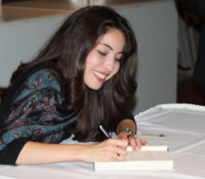 <p>Saberi signs her book outside of OEC auditorium. (Maggie Clemensen/TommieMedia)</p>