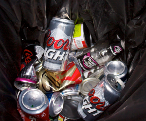 <p>Empty cans and bottles of Coors Light and Mike's Hard Lemonade remain in a recycling bin in Flynn Hall after a Friday night. SPPD District Commander, Matt Toupal, said St. Thomas "leads the pack" of large college parties because of the university's number of students compared to surrounding colleges. (Bjorn Saterbak/TommieMedia)</p>