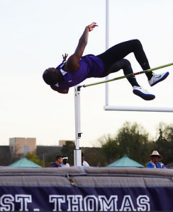 Eyo Ekpo clears the high jump bar in the MIAC championships. 