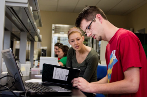 Senior Annie Keller and 2013 alumnus Jimmy Altendahl work on problem sets in a lab in Owens Science Hall in 2012. U.S. News and World Report gave St. Thomas a No. 112 national ranking in the liberal arts category Tuesday. (Rita Kovtun/TommieMedia) 