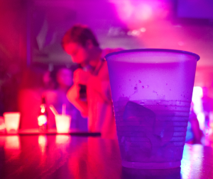 A St. Thomas student enjoys a drink Thursday night at Tiffany Sports Lounge. Recently there has been some concern about the safety of students at local bars because of assault cases. (Joey Anderson/ TommieMedia) 