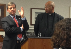 Members of the media listen as Brian Short, a task force member and a former legal mediator and U.S. magistrate, and the Rev. Reginald Whitt, St. Thomas law professor and Dominican deacon, answer questions about the  task force set to review issues related to allegations of clergy sexual misconduct in the Archdiocese of St. Paul and Minneapolis at a press conference Wednesday. (Briggs LeSavage/TommieMedia) 