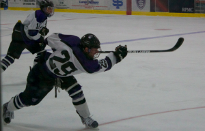 Forward Chris Cass takes a shot on net against Bethel University in January of the 2012-2013 season. The St. Thomas men's hockey team is hoping to use its deep roster to help kickstart a successful season. (Caroline Rode/TommieMedia)