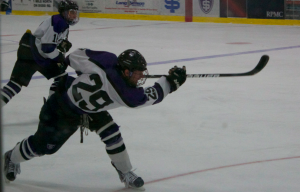 Forward Chris Cass takes a shot on net against Bethel University in January of the 2012-2013 season. The St. Thomas men's hockey team is hoping to use its deep roster to help kickstart a successful season. (Caroline Rode/TommieMedia) 