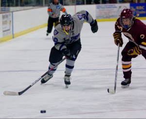 Forward Christina Rozeske races Cobber Libby Fransdal for the puck during their season ending loss to Concordia Moorhead last year. Rozeske previously lead the team with 14 goals. (Andrew Stafford/TommieMedia)