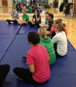 Students gather together in the Anderson Athletic Recreation Complex for an hour long self defense class taught by a professional mixed martial artist. The students bought tickets through General 11, a business class that sold tickets for their Business Law course that aims to put the theories the students are learning in class into practice. (Johnnay Leenay//TommieMedia)   