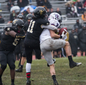 Wide receiver Dan Noehring hauls in a catch while fending off an Ole. Noehring finished the season with 24 receptions for 479 yards and one tochdown. (Andrew Stafford/TommieMedia)