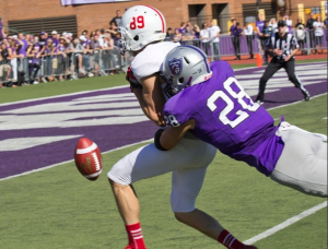 Defensive back Josh Carey stretches to break up a deep St. John's pass late in the fourth quarter of the Tommie-Johnnie game in September. (Andrew Stafford/TommieMedia) 
