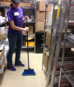 T's student employee Rachel Vetter sweeps in the cooler. The floors in T's and The View will undergo construction during winter break due to holes and scratches on the surface. (Johnnay Leenay//TommieMedia)