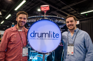 Jeff Sevaldson (left) and Joey Nesbitt (right) proudly display their illuminated drum.  Drumlite drums were used by the Red Hot Chili Peppers at the Super Bowl halftime show. (Photo courtesy of Alex Matthews) 