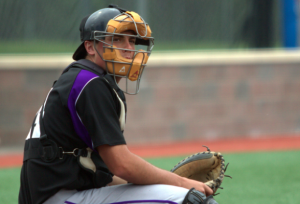 Catcher J.D. Dorgan looks over to the St. Thomas dugout during the final game of the 2013-14 season. Dorgan batted .365 with 50 hits on the season. (Ross Schreck/TommieMedia)