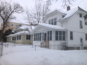 Real estate development firm Cullen LLC plans to tear down these three houses to build a four-story apartment building. The firm does not yet know when construction will begin on the complex. (Grace Pastoor/TommieMedia)