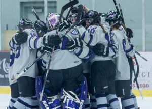 The Tommies gather together for a group hug to celebrate their 2-0 shutout and MIAC championship victory. St. Thomas will take on Wis. Stevens Point in the quarterfinals of the NCAA tournament. (Christina Theodoroff/TommieMedia) 