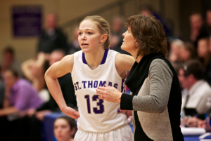 Coach Ruth Sinn lends some advice to Brandenburg. St. Thomas won the MIAC playoffs and earned an automatic bid to the NCAA tournament. (Jake Remes/TommieMedia).