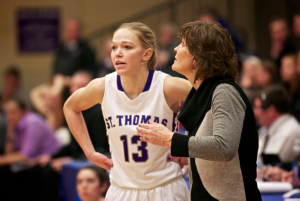 Coach Ruth Sinn lends some advice to Brandenburg. St. Thomas won the MIAC playoffs and earned an automatic bid to the NCAA tournament. (Jake Remes/TommieMedia). 