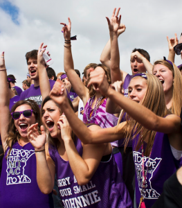 St. Thomas fans cheer on the football team during the Tommie Johnnie game in 2013-14. St. Thomas finished in sixth and fourth in attendance in the MIAC the past two seasons. (Andrew Stafford/TommieMedia)