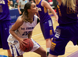 Forward Taylor Young looks for room in Loras territory. Young finished her career with 1,398 points, which puts her as the fourth highest scorer in St. Thomas history. (Jake Remes/TommieMedia)