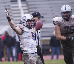 Running back Jack Kaiser celebrates his third touchdown in last year's 45-22 victory over St. Olaf. The Tommies have won five of the past six matchups against the Oles. (Andrew Stafford/TommieMedia)