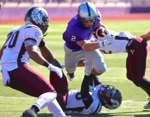 St. Thomas running back Nick Waldvogel carries the ball past Augsburg. Waldvogel scored three touchdowns before halftime at Saturday's Homecoming game. (Carlee Hackl/TommieMedia)