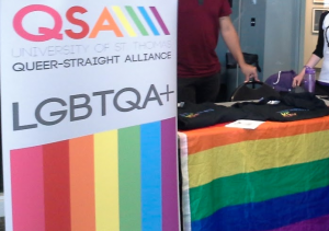 Members of St. Thomas’ Queer-Straight Alliance run a table in the Anderson Student Center Monday to raise awareness for National Coming Out Day. National Coming Out Day, which took place on Oct. 11., is a day for members of the LGBTQIA+ community to come out to family and friends. (Rebecca Mariscal/TommieMedia)