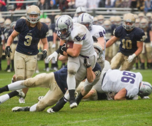 Running back Jack Kaiser busts through the Royal defense during the second quarter of last year's game. Kaiser finished the game with 140 yards and two touchdowns on 32 attempts. (Andrew Stafford/TommieMedia)