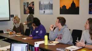 Members of the St. Thomas German Club discuss upcoming events while enjoying some schnitzel. The German Club started hosting events Oct. 16 to celebrate the 25th anniversary of the fall of the Berlin Wall. (Theresa Bourke/TommieMedia)