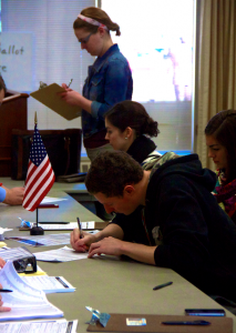 Sophomore Tom Larocca fills out voter registration in McNeely Hall. Students living on North Campus can vote in McNeely while students living on South Campus can vote at Groveland Recreation Center. (Elena Neuzil/TommieMedia)