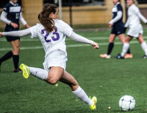 Defender Hailey Zweber prepares to launch a shot against Carleton. The Tommies advanced to the MIAC semifinals Tuesday. (Jake Remes/TommieMedia)