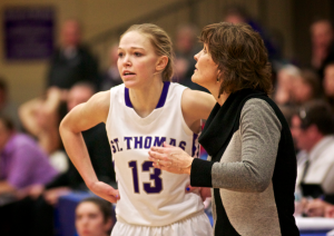 Women's basketball coach Ruth Sinn lends some advice to guard Kelly Brandenburg in last seasons game against Wisconsin-Whitewater. Sinn said interest level in women's sports has evolved. (Jake Remes/TommieMedia)