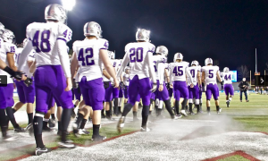 The St. Thomas football team enters Salem Stadium for the 2012 NCAA Stagg Bowl. St. Thomas made the NCAA Division-III Championship Game in its last playoff appearance. (Rosie Murphy/TommieMedia)