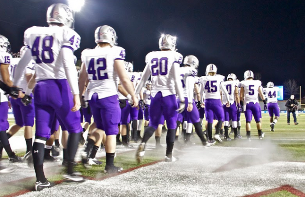 The St. Thomas football team enters Salem Stadium for the 2012 Stagg Bowl against Mt. Union. The 2015 Tommies will face Mt. Union again this year. (Rosie Murphy/Tommiemedia)