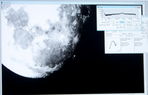 A picture of the moon that was taken by an observatory telescope is displayed at the event. St. Thomas professor Elizabeth Wehner took pictures of the moon, stars and galaxies Wednesday night while those in attendance observed. (Theresa Bourke/TommieMedia)
