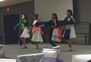 A group of students dances in traditional Hmong clothing at HUSA's annual Hmong New Year. The show also included a play, musical performances and a fashion show (Lauren Smith/TommieMedia)