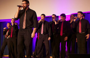 Senior Mike Fairbairn sings Katy Perry's "Wide Awake" at the Summit Singers' concert last semester. The group plans to put a mix of new and old songs on its upcoming album. (Rebecca Mariscal/TommieMedia)
