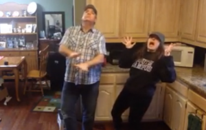Ali Hoffman, St. Thomas '14, and her father, Michael, dance in their kitchen to Bruno Mars' song 'Uptown Funk.' Their video reached more than 10.2 million views, 78,000 likes and 230,000 shares on Facebook. (Photo courtesy of Ali Hoffman)