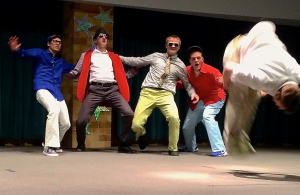 The seminarian dance crew watches as sophomore Reed Flood completes the routine with a backflip. They started practicing six weeks before the talent show and received first place. (Margaret Galush/TommieMedia)