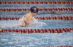 Senior Emily Punyko surfaces for a breath while swimming the 200 medley relay at last year's MIAC Championships. Punyko was recognized as an Honorable Mention for her role in this year's 200 free relay at the NCAA Championships. (Christina Theodoroff/TommieMedia)