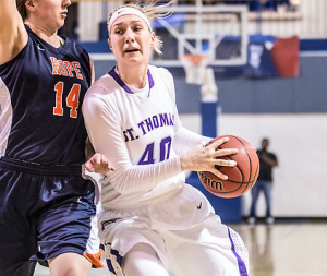 Center Maggie Weiers drives the paint in the playoff game against Hope College March 13. Weiers earned Second-Team All-America honors, averaging 12.3 points and 7.9 rebounds per game. (Jake Remes/TommieMedia)