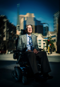 Bruce Kramer, former dean of the College of Education, Leadership and Counseling, poses in downtown Minneapolis near the St. Thomas campus in August 2012. Kramer passed away from amyotrophic lateral sclerosis Monday afternoon. (Photo courtesy of Mike Ekern/University Affairs)