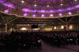 Members of the class of 2014 prepare to throw their graduation caps in the air at the close of last year's commencement ceremony. This year's commencement ceremony will be held on campus.  (Grace Pastoor/TommieMedia)